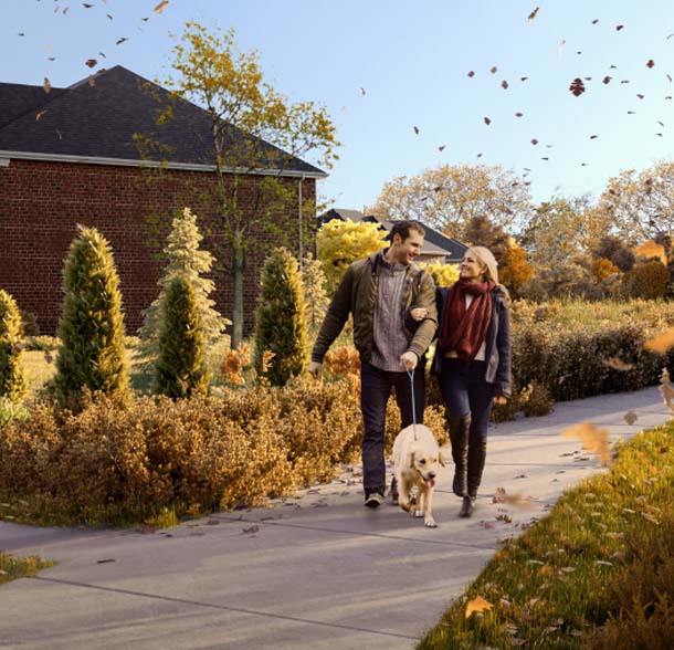 Couple walking in the park during the Fall season. The Heights of Harmony in Oshawa.