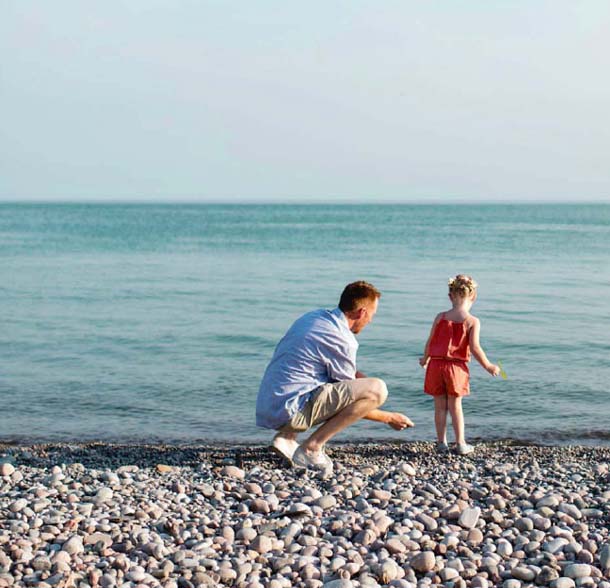 Father & daughter skipping stones in Lake Ontario. The Heights of Harmony in Oshawa.