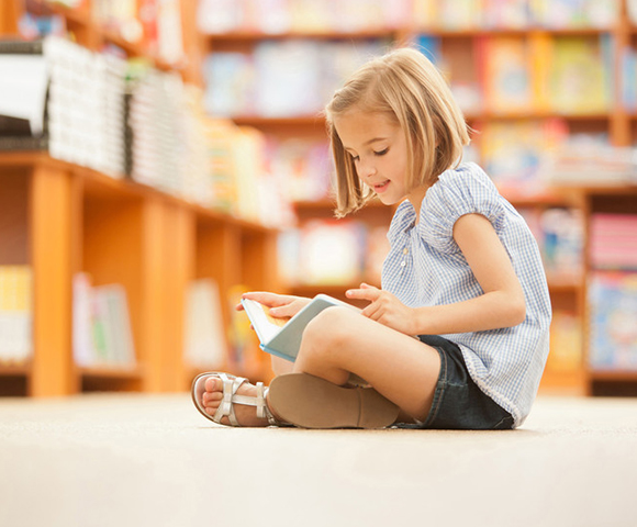 Child reading in a school in Manotick